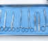 stainless steel surgical instruments arranged on a sterile tray